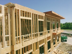 Wood framing rising on a new Yeager building