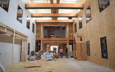 The timber-framed atrium of a Texas building under construction
